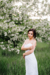 Fototapeta na wymiar bride in a white dress with a large spring bouquet