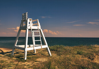 lifeguard chair and sky on a sandy beach