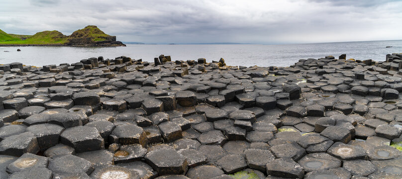 Giant's Causeway basalt rocks pattern in a beautiful summer day, Northern Ireland. The nature hexagon stones result of an ancient volcanic fissure eruption.