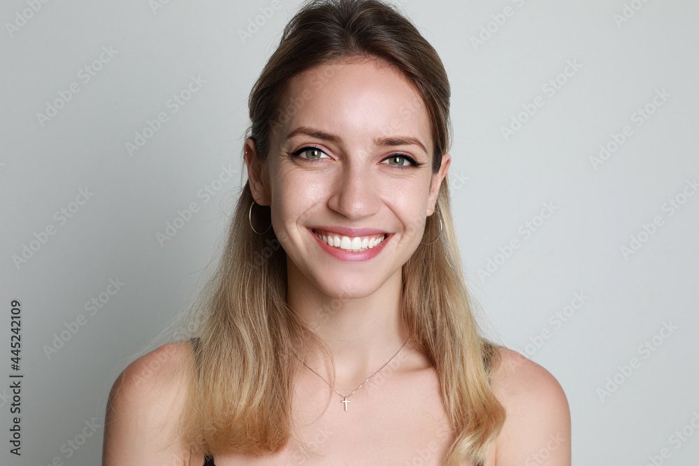 Poster Portrait of beautiful woman on light background