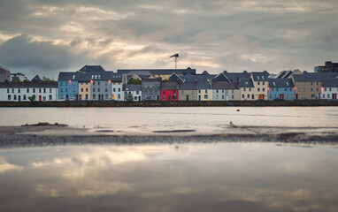Cityscape of colorful houses by the Corrib River at Claddagh, Galway City, Ireland 