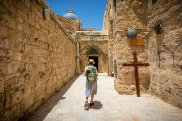 Fototapeta na wymiar 9th Station of the Cross' on Via Dolorosa in old Jerusalem city The route Jesus took to Calvary, Israel june 2021
