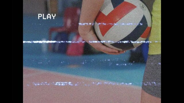 Animation of screen with interference over volleyball player with ball