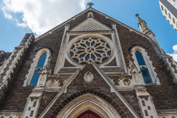 Fototapeta na wymiar Old neo-gothic church with a broken steeple at the facade through earth quake, Auckland
