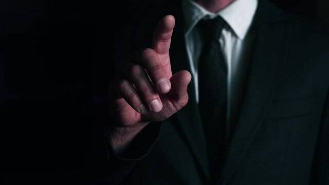 video businessman presses the index finger of his right hand on a virtual button to start the data analysis process