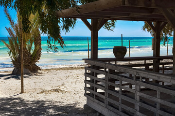 Beautiful views of the Mediterranean coast with birch water, white sand beach and bungalows on the...