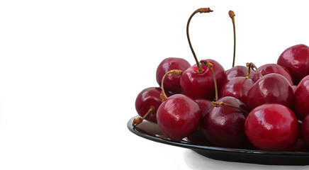 ripe sweet cherries on a plate, sweet cherries isolated on white background