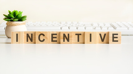 incentive word made with wooden blocks, concept