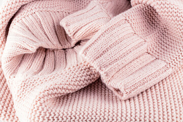 Fototapeta na wymiar Pastel pink warm cozy sweater.