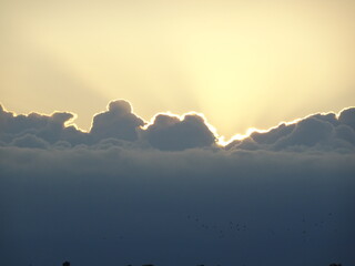 Sunset behind clouds
