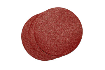 Fototapeta na wymiar Grinding wheel made of red sandpaper on a white background.Round nozzle made of sandpaper for grinding.