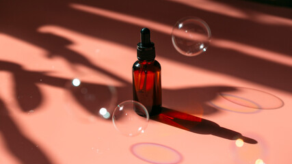 Glass bottle with a pipette. Cosmetic moisturizing essential oil for face and body skin care. 