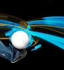 leg kicking a ball with neon ray light effect spinning around