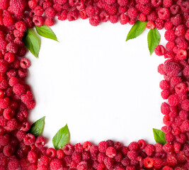 Raspberries on a white background, isolated objects, green leaves, red summer berries, background for the text