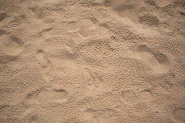 Footprint on sand on beach. Sandy beach. Summer, holidays background, vacation concept