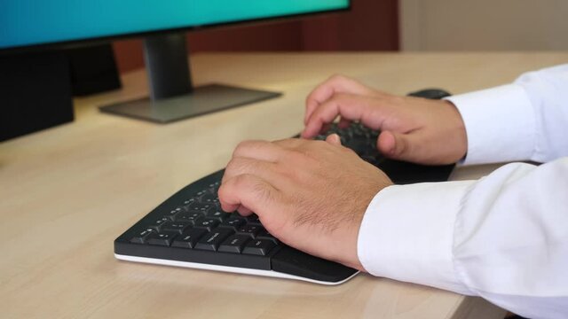 Hands of Staff Working at Desk