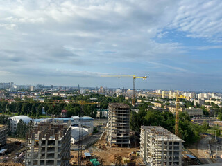 Aerial view construction of a high-rise business center in the big city. Beautiful panoramic landscape of the city at dawn from a height