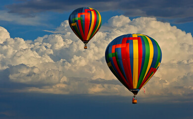 Hot air balloons with clouds in the background
