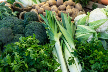 Close up of various healthy vegetables such as broccoli, cauliflower, potatoes and garden leek...