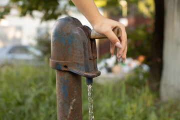 Pressurized water. Water supply hydrant in the village.
