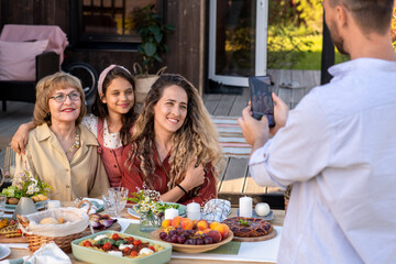 Man Photographing Family