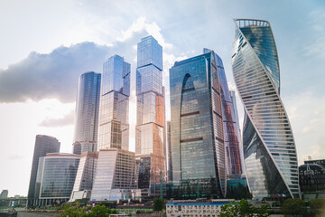 Russia. Skyscrapers in the center of Moscow. High-rise buildings in the capital of the Russia. Complex Moscow-city against the gray sky. Skyscrapers and a glazed bridge 