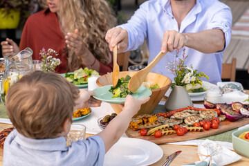 Little Boy Asking for Portion of Salad