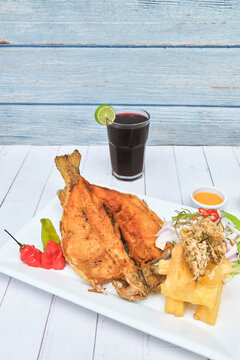 PERUVIAN FOOD, typical dish Fried trout, with rice, yucca and salad, Sective Focus