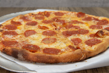Pepperoni pizza with crispy crust and melted cheese for a perfect lunch date