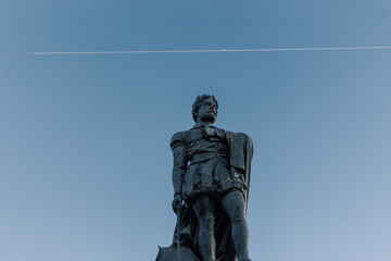Low angle shot of the Camoes Monument against blue sky in Luis de Camoes Square, Lisbon, Portugal