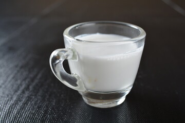 fresh milk in white glass on wood background asian dessert menu