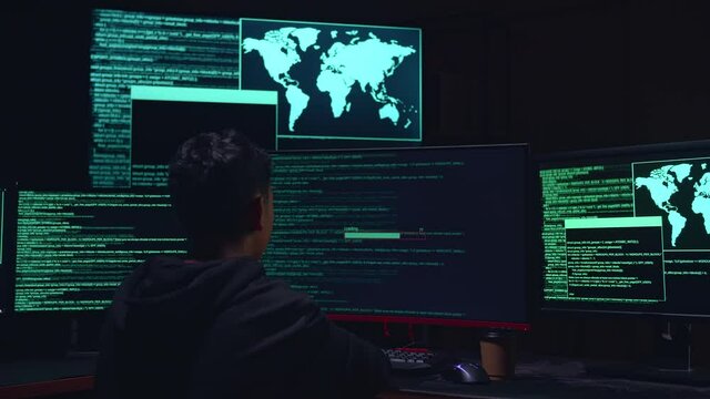 Asian Boy Hacker Using Multiple Computer Hacking And Success Downloading Data
