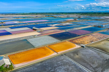 Phetchaburi Salt flats Naklua, farms and farmers collecting salt in Phetchaburi, Thailand