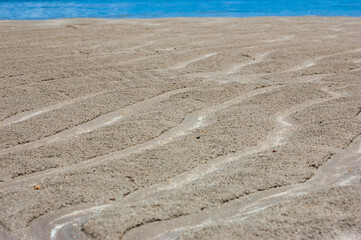 sand drawn texture on the beach and sea