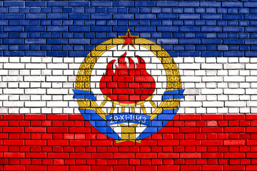 historical flag of Yugoslavia painted on brick wall