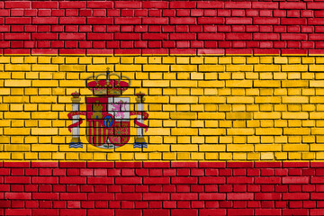 flag of Spain painted on brick wall