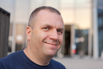 Face of smiling mature European man of large build.