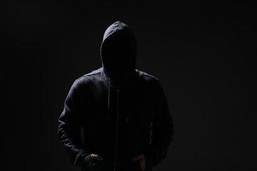 Fototapeta na wymiar Silhouette of anonymous man on black background
