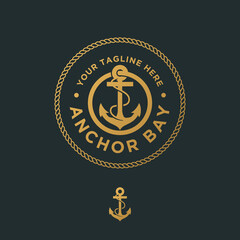 Vector graphic of premium anchor logo emblem, abstract anchor into rope circles in gold color © Avni Design