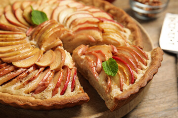 Delicious apple pie on wooden table, closeup