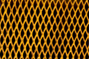 Yellow painted metallic plate anti slip surface. Metal diamond plate texture. yellow steel grating...
