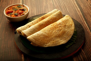 Masala dosa- spicy smashed potato stuffed rice pancakes ,Indian traditional cooking recipes.