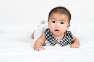 happy baby newborn on bed