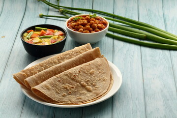 Homemade Indian meal- Healthy wheat flour chapati served with chickpeas, chana masala curry .