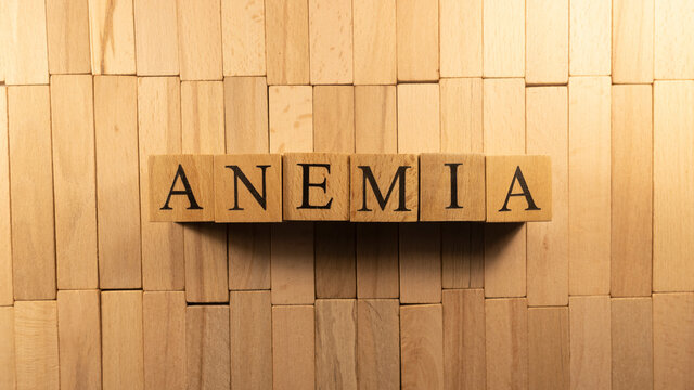 The word anemia was created from wooden letter cubes. Illness and health
