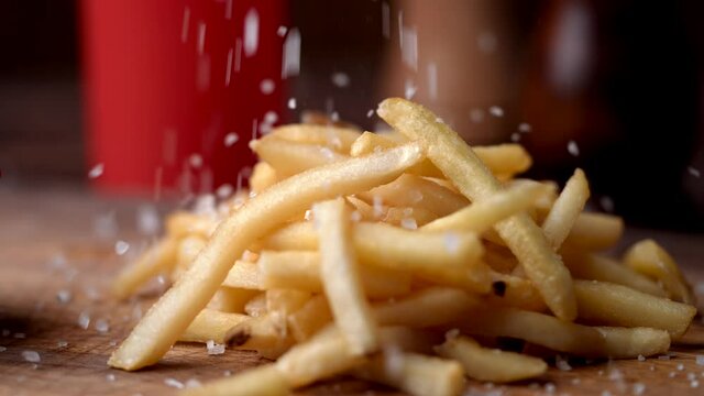 seasoning french fries with salt