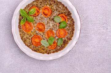 Buckwheat casserole with tomatoes