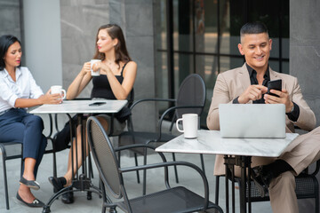 Business Man Working on Smartphone in Coffee Shop while Breaking time