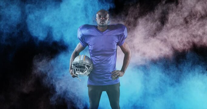 Animation of colourful powders over american football player