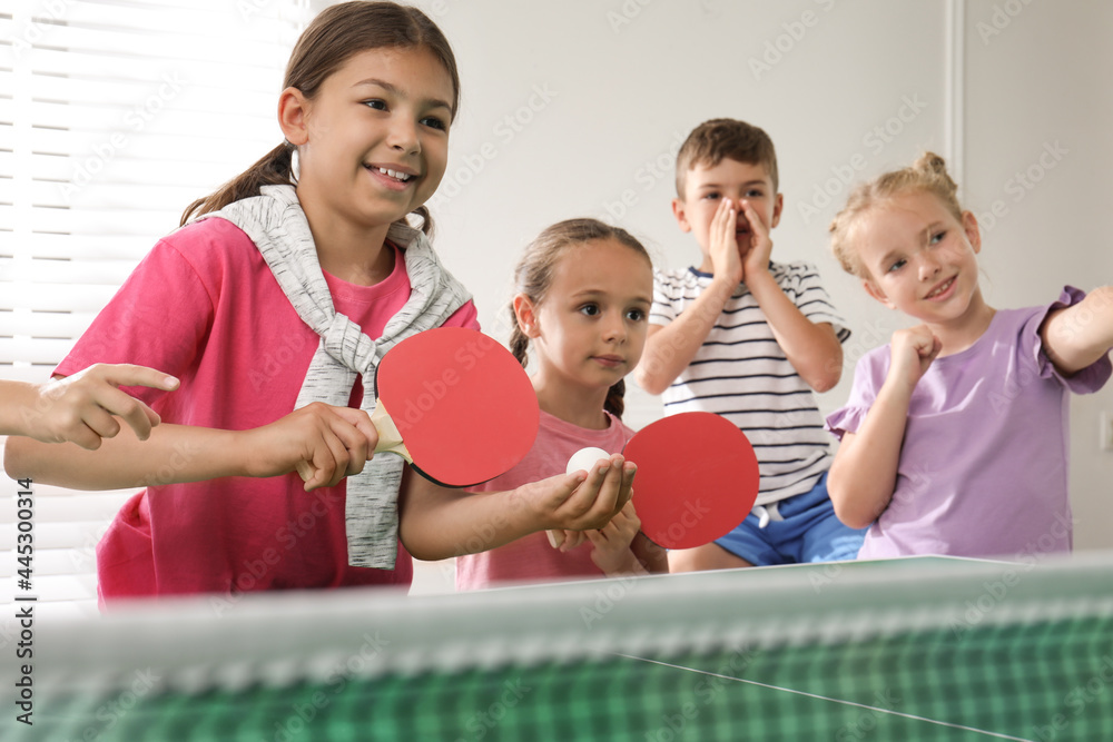 Sticker cute happy children playing ping pong indoors